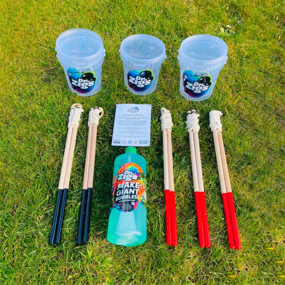 Dr Zigs eco-friendly celebration/memorial bubble kit laid out on some grass