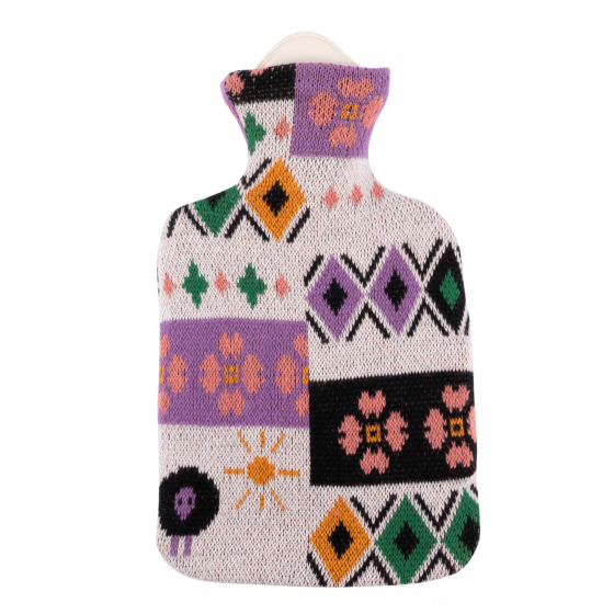 Eco Living natural rubber hot water bottle in Nayla print. Pink, purple, black, green and yellow geometric and flower print on a cream base. There's even a little sheep and sun on the bottom left hand corner! 
