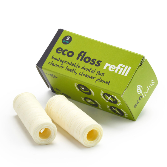 Ecoliving plastic-free vegan dental floss rolls on a white background next to their green cardboard packaging