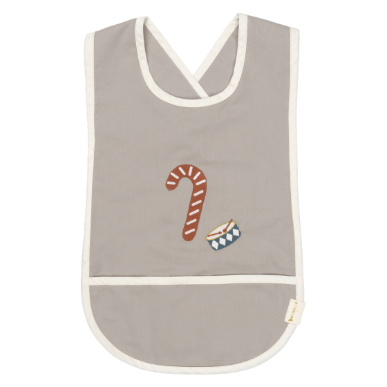 Front of the Fabelab kids organic cotton bib with an embroidered candycane and drum on the front