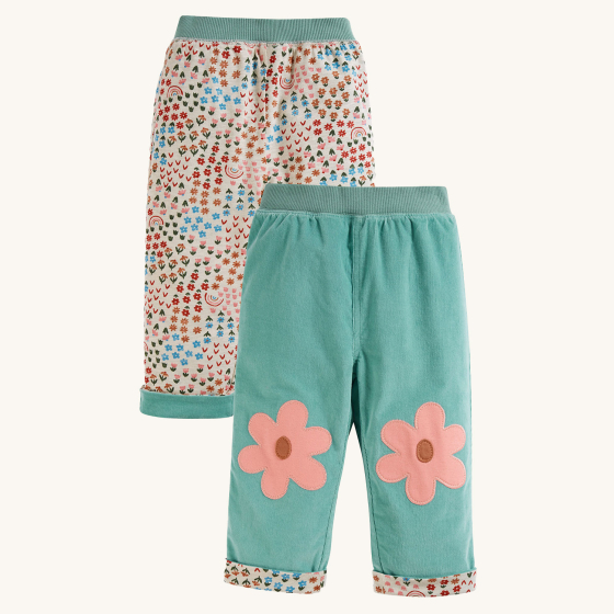 Frugi Tess Cord Reversible Trousers - Moss / Floral Fun against a plain background.