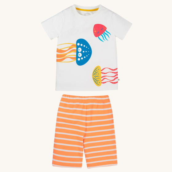 Frugi Children's Organic Cotton Porthleven Pyjamas - Jellyfish. A white pyjama short-sleeve t-shirt with fun and colourful jelly fish prints, paired with light orange and white stripe pyjama shorts on a cream background