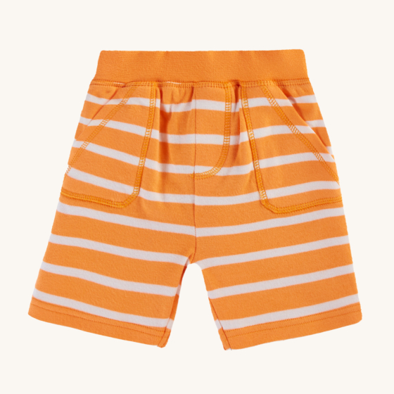 Frugi Organic Little Ellis Shorts - Tangerine Breton Stripe. A super soft organic cotton shorts in bright tangerine orange and white Breton stripes, and a comfy elasticated waistband with two handy pockets, on a cream background