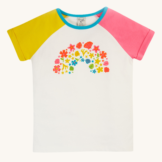 Frugi Children's Organic Cotton Nyomi Raglan T-Shirt - Rainbow. A fun short-sleeved t-shirt for kids from Frugi has a white body, contrasting pink and yellow raglan sleeves, and features a colourful floral rainbow graphic on the front in flower blooms