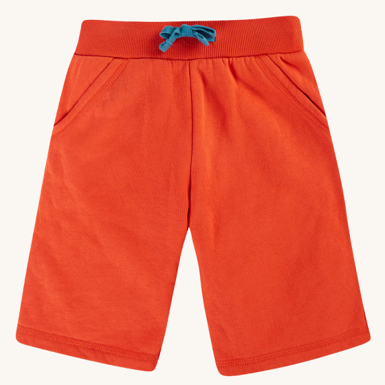 Frugi Switch Samson Shorts - Orangutan. Orange organic cotton brushback shorts with functional blue drawstring elasticated waistband and pockets, made from GOTS In-Conversion Cotton, on a cream background.