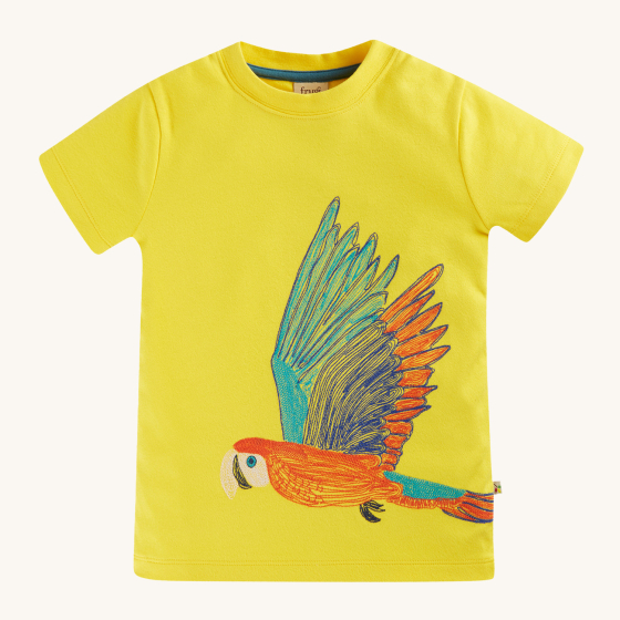 Frugi Organic Carsen Embroidery T-Shirt - Banana / Macaw. A bright, banana yellow, soft organic cotton top, with a flying embroidered Macaw print. On a cream background