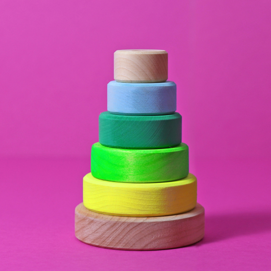 Grimm's Small Conical Stacking Tower - Neon Green - On a plain pink background.