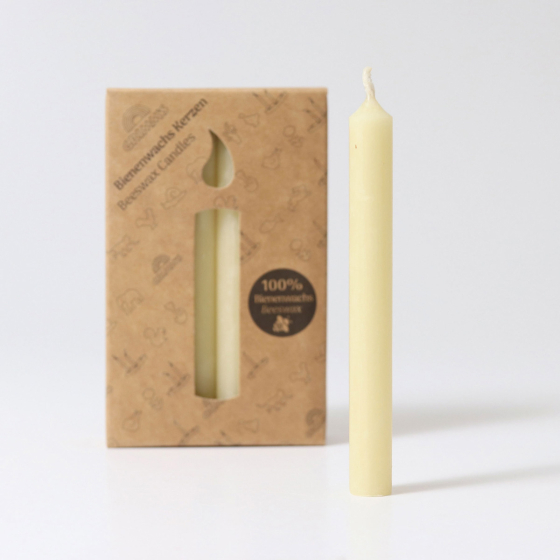 A pack of 12 Cream 100% beeswax candles in a cardboard box, with a single candle in front. White background.