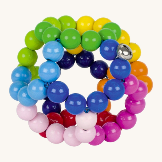 Heimess large elastic rainbow baby teether ball on a beige background
