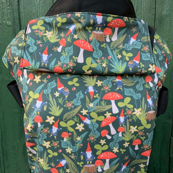 Integra Size 2 Gnomes Regular Strap Baby Carrier against a green wooden background.