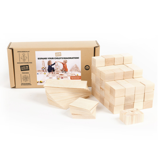 Just blocks eco-friendly childrens beech wood toy building blocks piled up on a white background next to their cardboard box