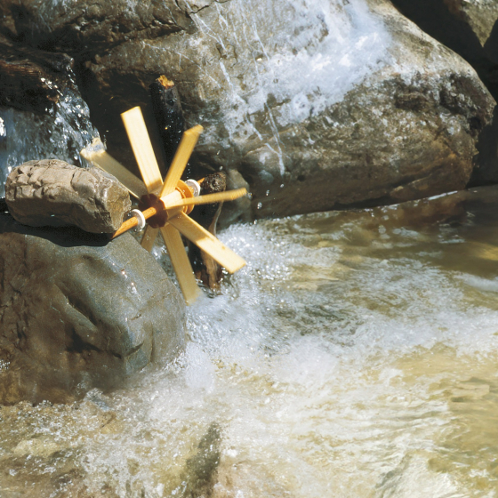 Kraul small waterwheel kit set up on a river.