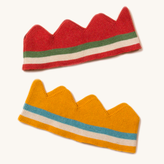 LGR kids red and yellow organic cotton crowns laid out on a white background
