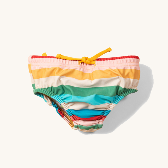 Little Green Radicals Rainbow UPF 50+ Recycled Swim Nappy. Made with 82% Recycled Nylon 18% Spandex, this fun rainbow striped swimming nappy comes with an elastic drawstring at the front, and elasticated waste and legs for easy dressing.