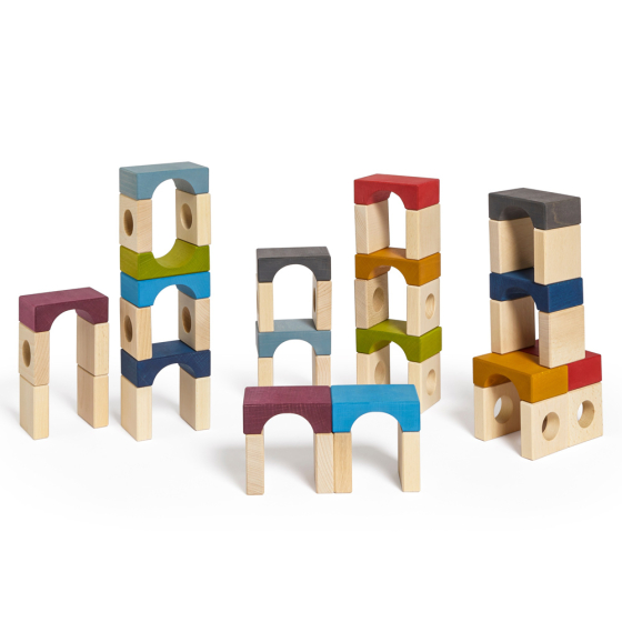 Lubulona handmade wooden stacking tunnel block toys stacked in towers on a white background