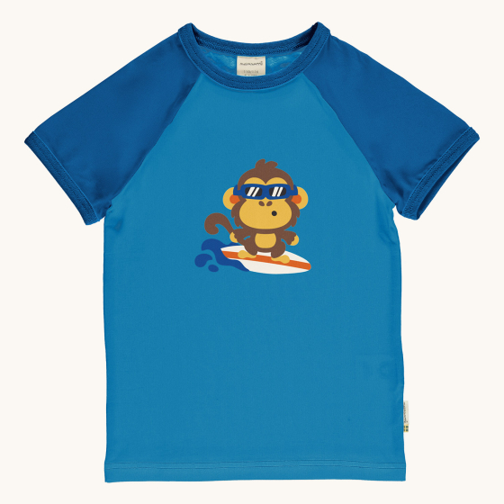 Maxomorra Children's Organic Cotton Monkey Raglan Short Sleeve Top. A light blue fabric with surfing monkey print on the chest, with navy blue piping on the neck and navy blue sleeves