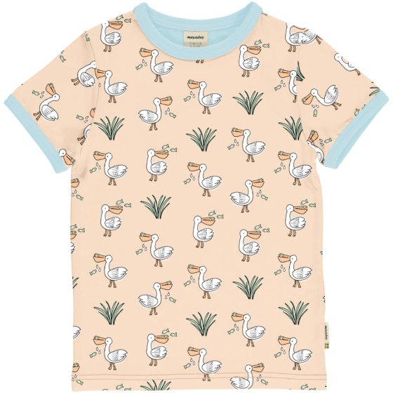 Meyadey Salty Pelican Organic Short Sleeved Top T-shirt. A light Peach base with repeated small colourful pelican and grass, with contrasting light blue piping. Picture on a white background