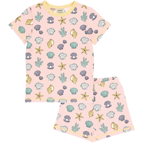 Meyadey Salty Shell Organic Short Sleeved Pyjama Set. A light pink base with repeated small colourful shells, starfish and seaweed (front and side views), with contrasting light yellow piping and stitching. Picture on a white background