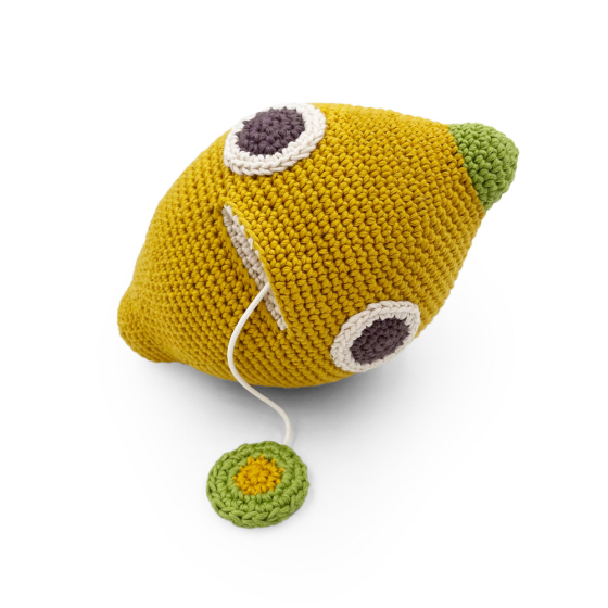 Myum John Lemon handmade crochet music toy with the pull string extended on a white background