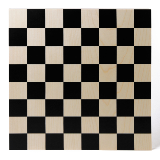 Naef precision manufactured wooden chessboard on a white background