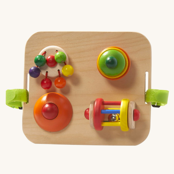 Nic toys wooden baby game board on a beige background