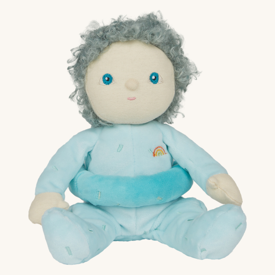 Olli Ella Dinky Dinkum Doll Sweet Treats - Franny Frosting. A soft floppy doll with a plush velvety light blue onsie, grey/blue hair, and a light blue sprinkle removable doughnut belly band, on a cream background