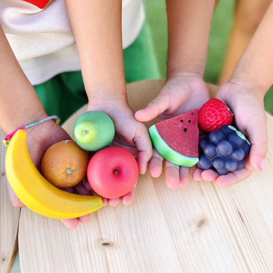 Olli Ella Tubbles Stones - Fantastic Fruit image showing children holding the Fantastic Fruit Tubbles Stones in their hands