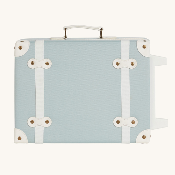 Olli Ella Kids See-Ya Suitcase in a steel blue colour on it's side pictured on a plain background