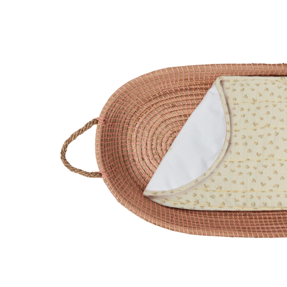 Olli Ella organic cotton luxe basket liner in the leafed mushroom print, inside a rattan basket, on a white background