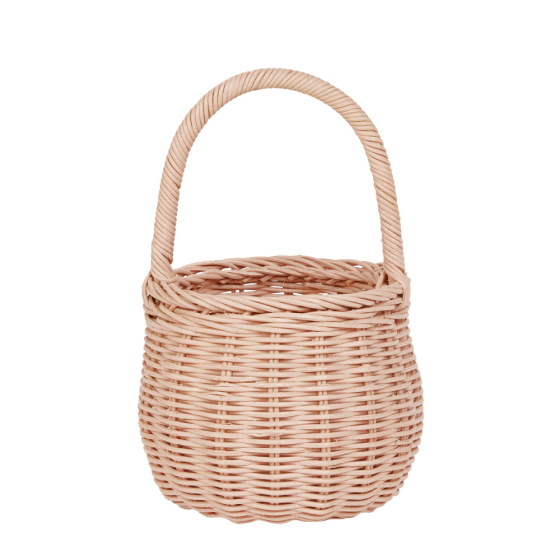 Olli Ella eco-friendly natural rattan berry basket in the rose colour on a white background