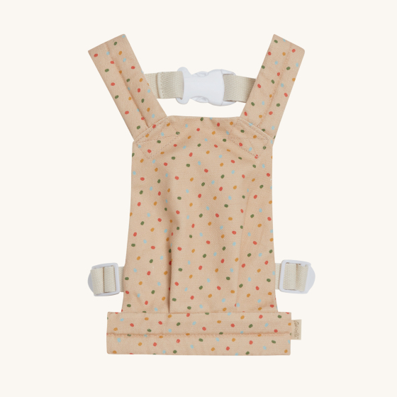 The Dinkum Doll Gumdrop Carrier is peach cream with an all-over multicolour jellybean pattern, white background.