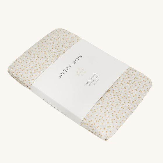 Avery Row Baby Muslin Swaddle - Daisy Meadow, made from super soft, organic cotton. A delicate daisy flower detail on a light coloured muslin cotton fabric, wrapped in Avery Row branded packaging.