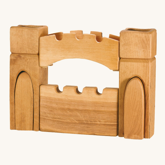 Ostheimer children's handmade wooden castle gate and towers set on a beige background