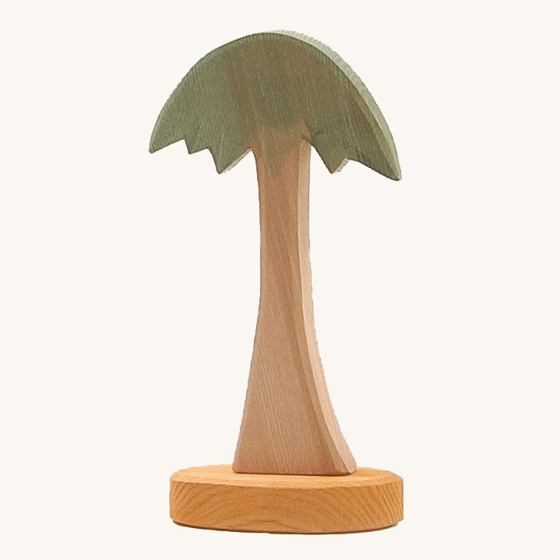 Ostheimer childrens handmade wooden palm tree toy on a beige background