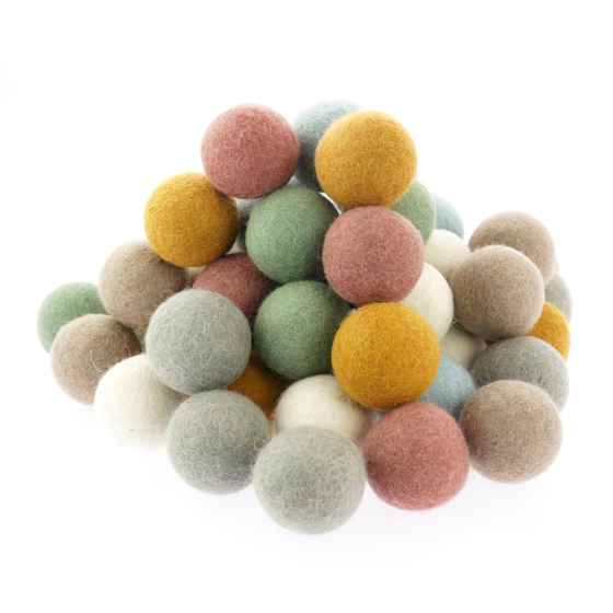 Pack of 49 Papoose handmade soft felt earth balls stacked in a pile on a white background