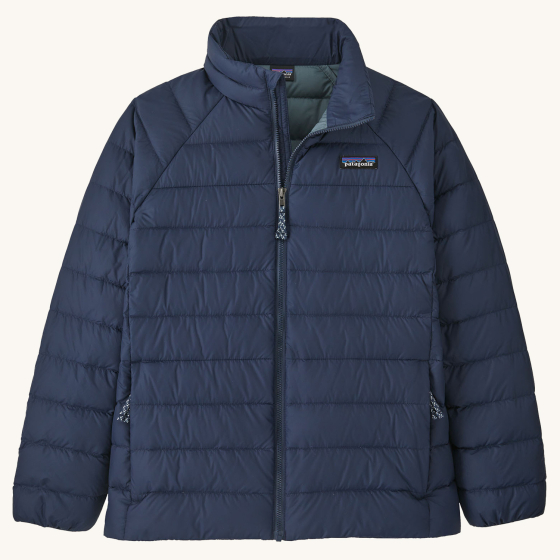 Patagonia Kids Down Sweater - New Navy on a plain background. This is the front of the jacket with the zip closed.