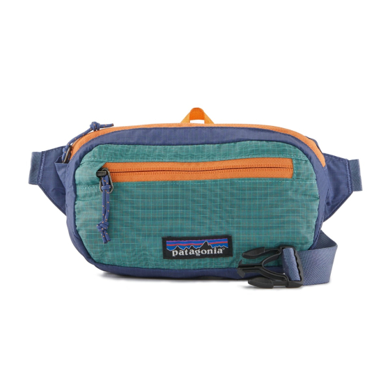 The Patagonia Ultralight Black Hole Mini Hip Pack in Fresh Teal, stood upright, front facing, on a white background