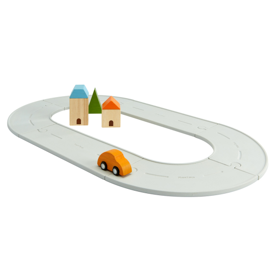 PlanToys small rubber road and rail toy set, laid out in a road scene on a white background