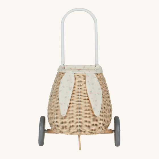 Olli Ella Rattan Bunny Luggy with Lining – Pansy Floral. A beautifully woven pull along Luggy basket with cream cotton lining with a vintage pansy floral pattern, bunny ears and a white fluffy tail, on a cream background