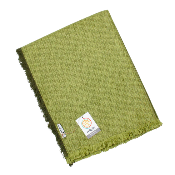 Respiin recycled wool throw blanket in the fern green colour folded on a white background