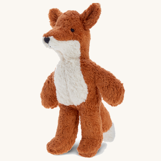 Senger Animal Baby Fox Toy. Made entirely of sustainably-produced cotton plush, and can safely be sucked or chewed, a soft body plush toy fox in light brown/ginger with a white fluffy belly, on a cream background