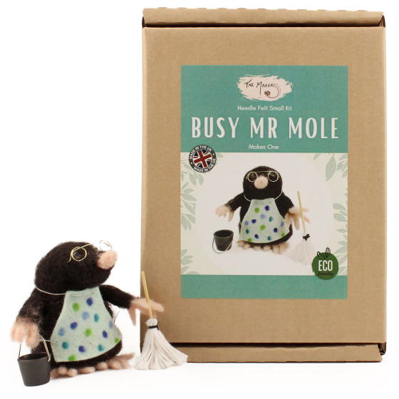 The Makerss Needle Felt Busy Mr Mole. A beautifully crafted mole wearing glasses, a spotted apron a mop and a bucket, stood next to its box
