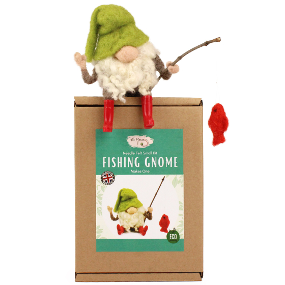 The Makerss Needle Felt Fishing Gnome. A beautifully crafted fishing gnome with a green hat, white bushy beard, little red wellington boots, a small fishing stick and a small red fish, sat on top of its box