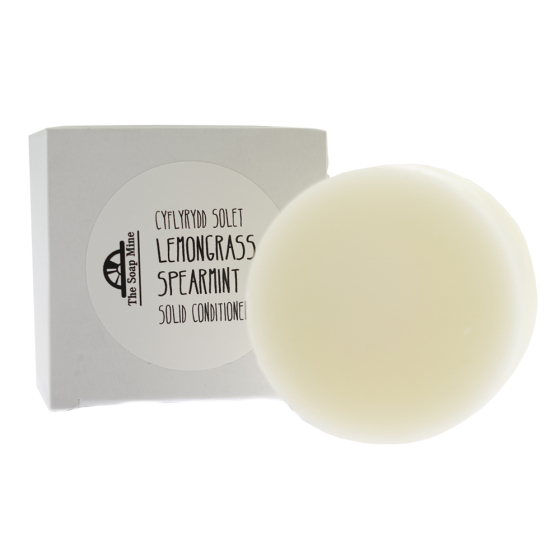 The Soap Mine lemongrass and spearmint solid conditioner bar next to its cardboard box on a white background