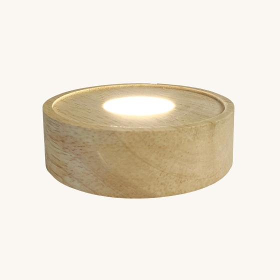 Toverlux Light Wishes Base lamp. A round wooden base with an L.E.D light in the middle to illuminate the light wish silhouettes