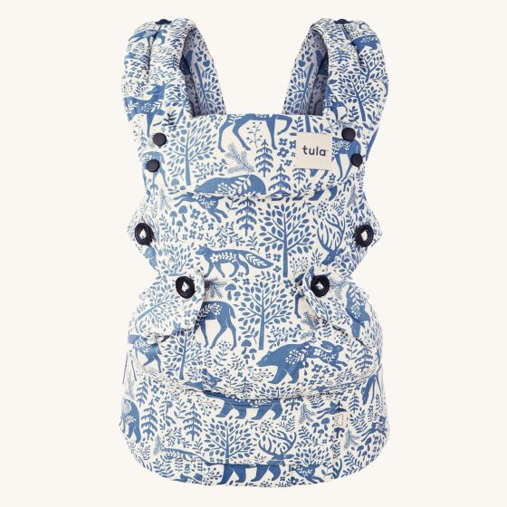 Tula Ergonomic Multi-Position Explore Baby Carrier 7-45lbs in Moonlit Forest. A white carrier with magical forest prints including bears, foxes, rabbits, deer and trees in a light blue colour.