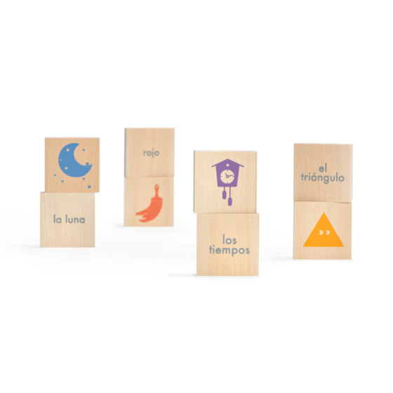 Uncle Goose handmade wooden Spanish vocabulary blocks stood up in 4 rows on a white background