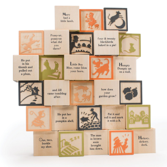 Uncle goose nursery rhyme master building blocks set stacked in a pile on a white background
