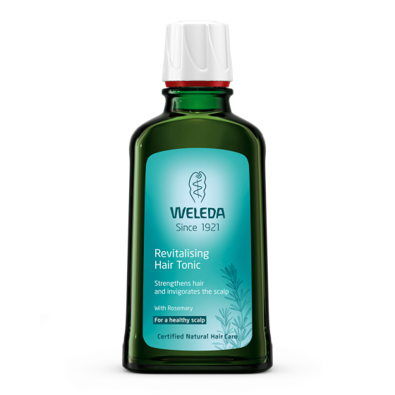 Weleda Revitalising Hair Tonic, a proven natural treatment for thinning, brittle hair, hair loss, dandruff and scalp dryness. In a green glass bottle with blue label. 