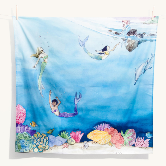 Wonderie childrens tales of mermaids play cloth hanging from a rope line in front of a white background